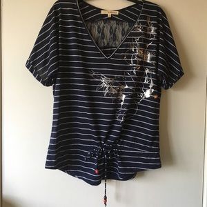 Adorable striped top with lace back.